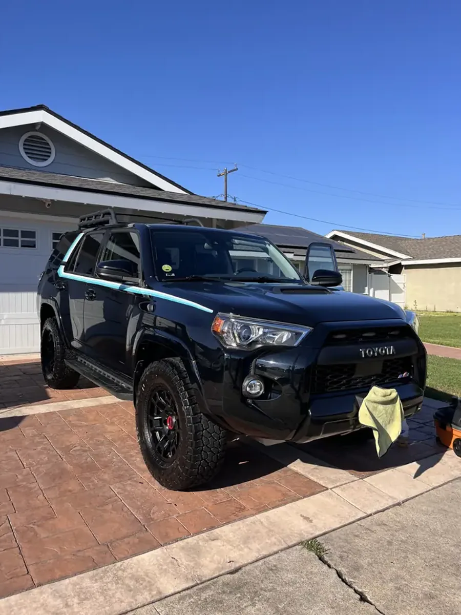 Freshly detailed black Toyota 4Runner in a Westminster driveway — Apex Shine mobile auto detailing